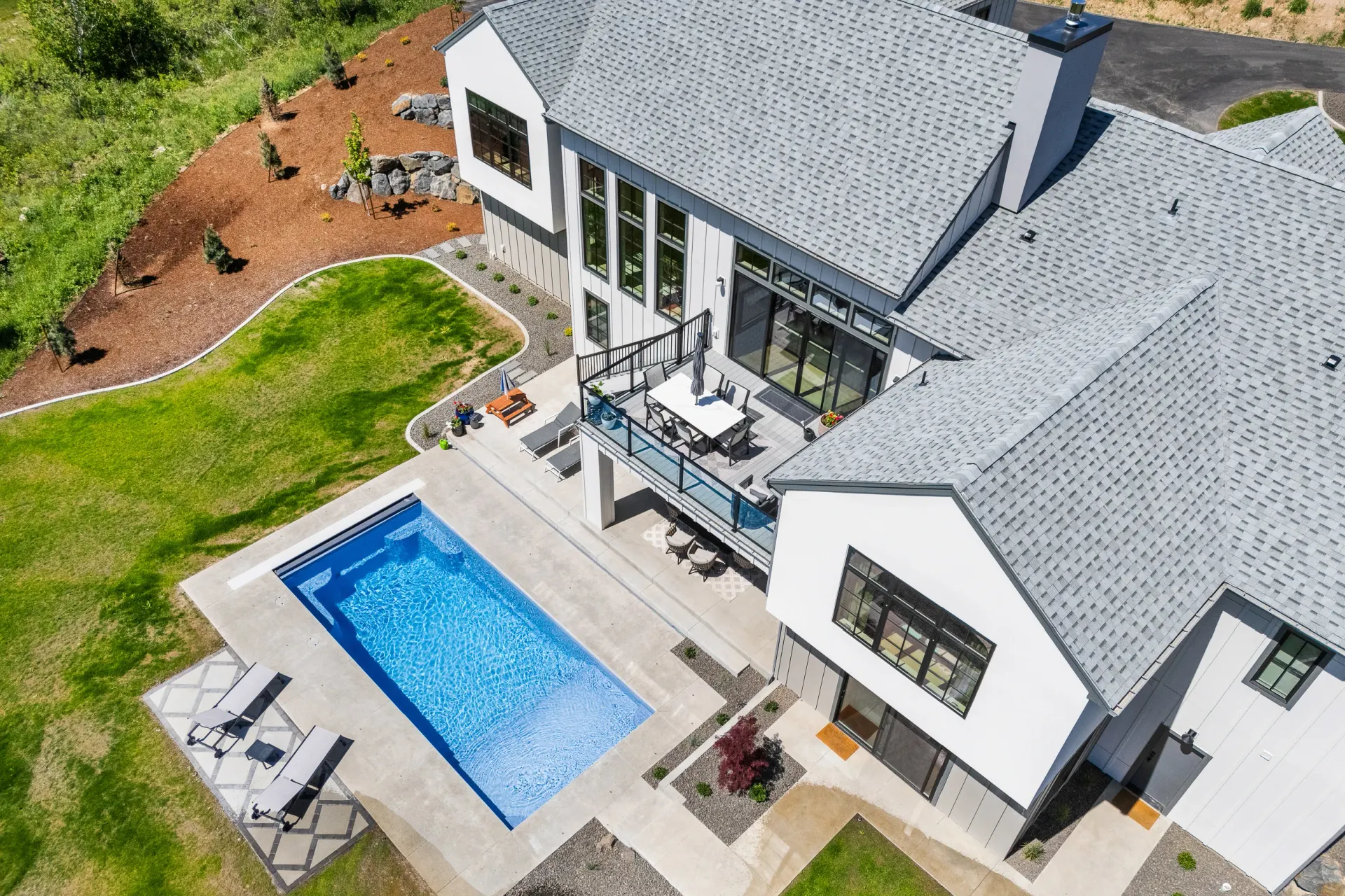 Aerial view of a finished Waterscape fiberglass pool in a Spokane backyard
