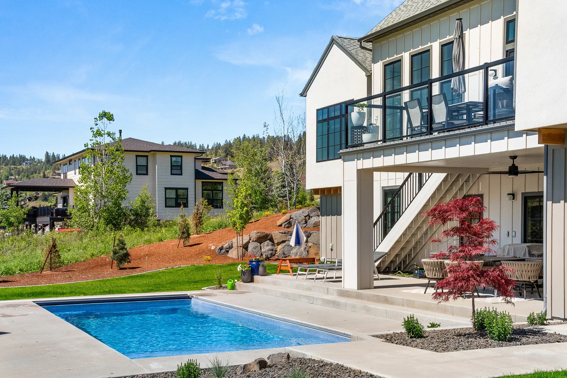 Modern home with a finished pool and clean deck layout