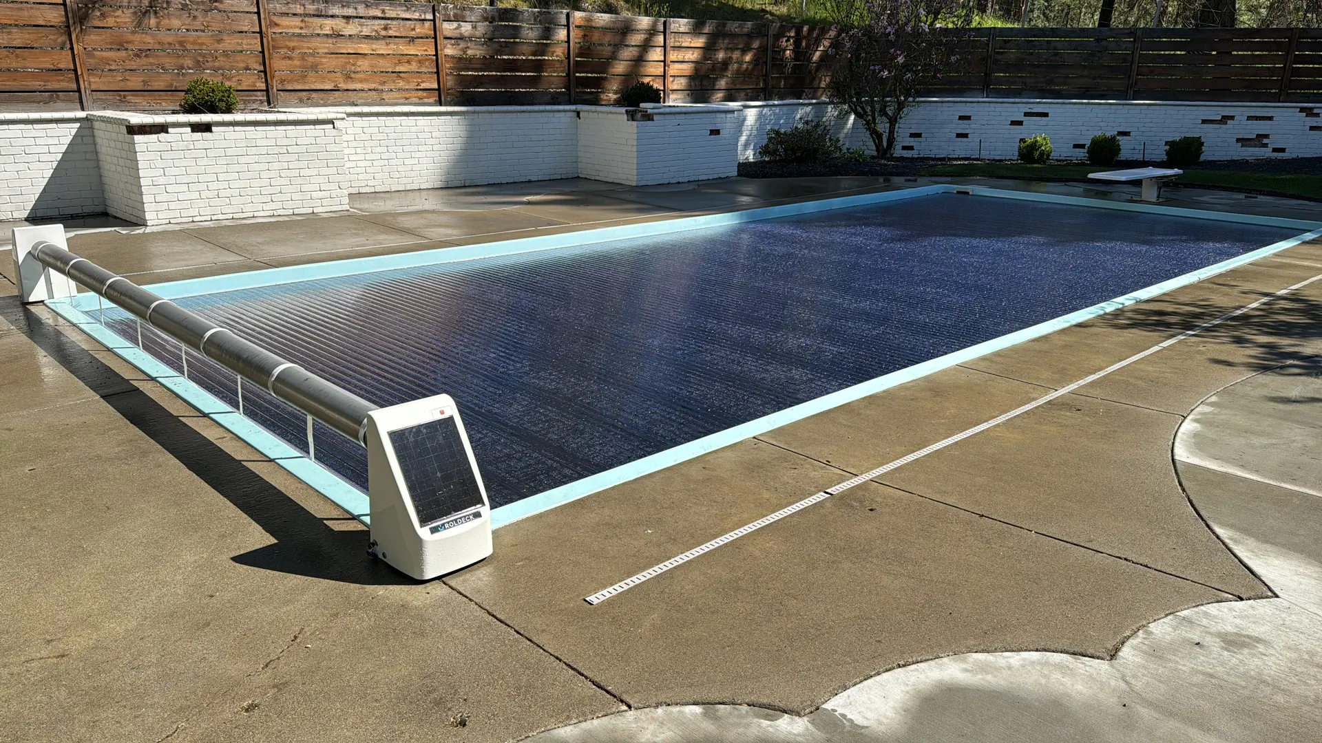 Rectangular in-ground pool with automatic safety cover closed