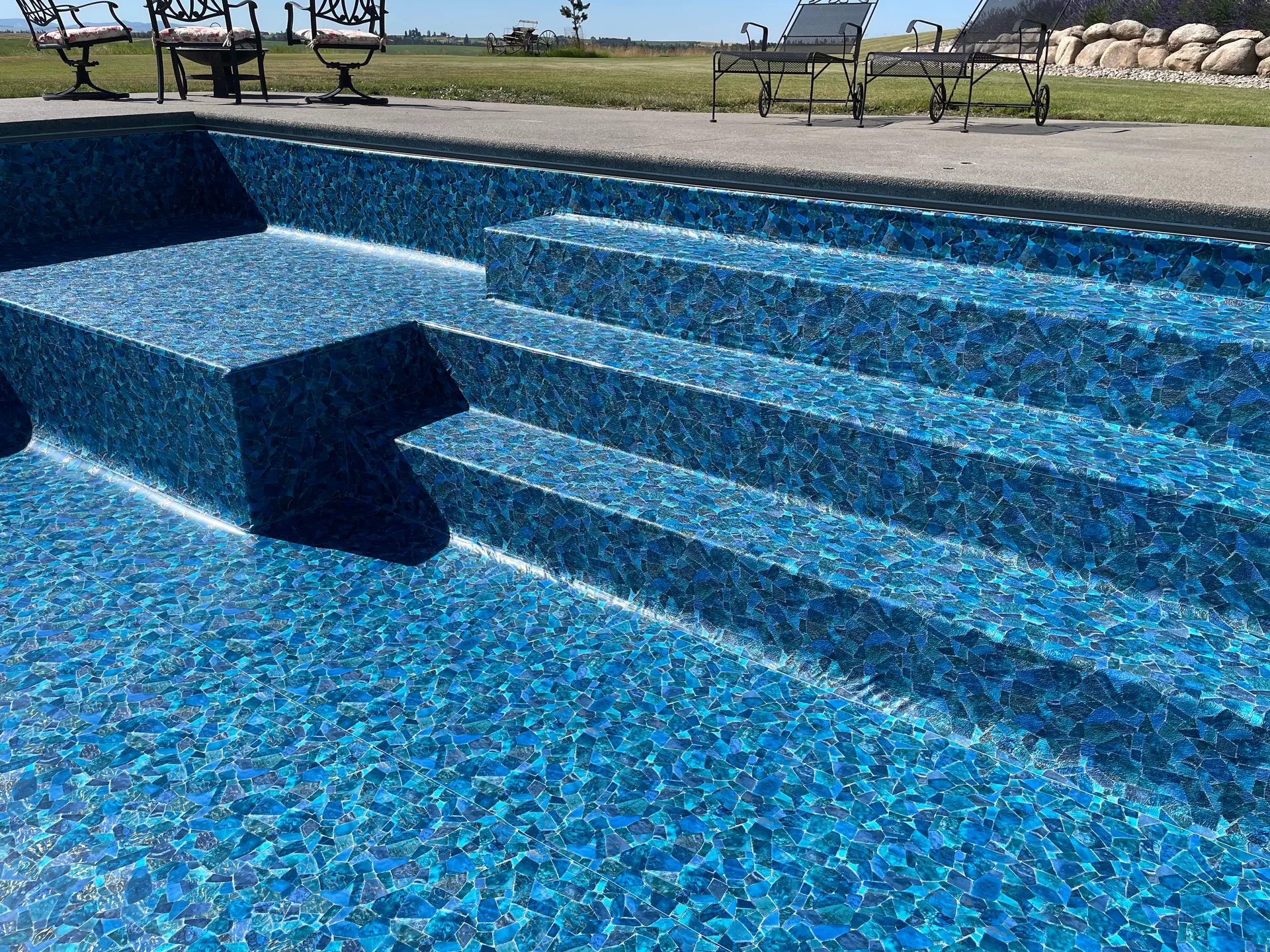 Close-up of vinyl-liner pool steps and bench